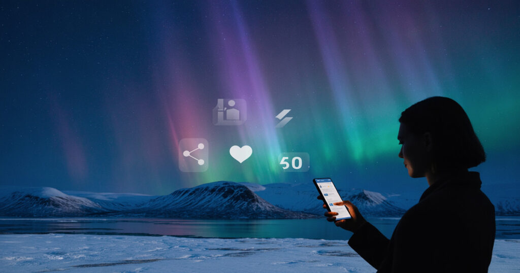 Arctic influencer marketing strategy showing a content creator with smartphone against northern lights aurora borealis background